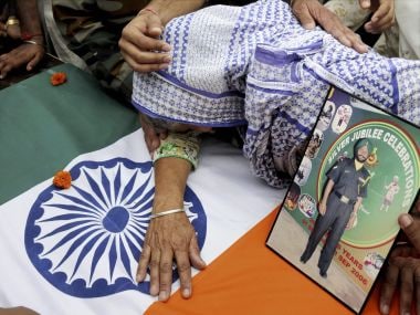Late Naib Subedar Paramjit Singh's mother mourns near her son's body. PTI