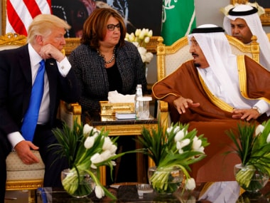 US President Donald Trump talks with Saudi King Salman. AP
