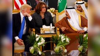 Embattled Donald Trump starts foreign tour with Saudi arms deal