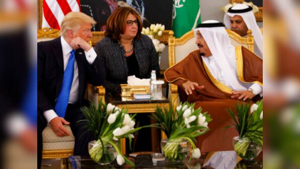 Embattled Donald Trump starts foreign tour with Saudi arms deal