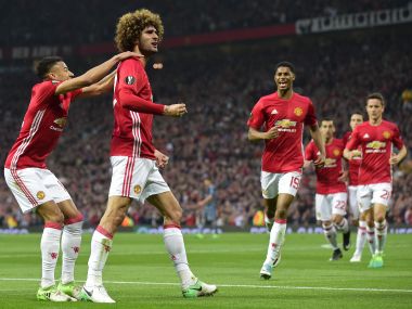 Marouane Fellaini (second from left) celebrates with teammates after scoring against Celta Vigo. AFP