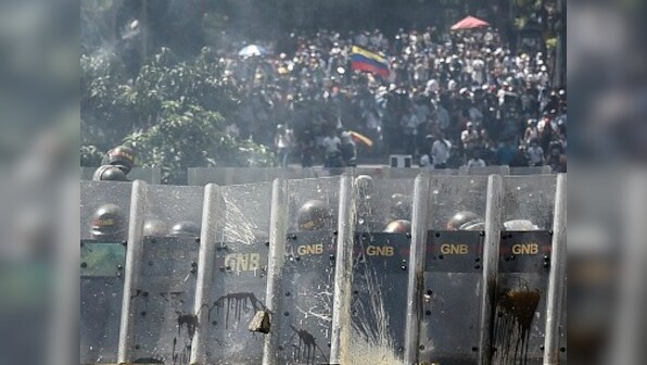 Venezuela crisis: Unrest continues as police fire tear gas to halt anti-government protesters