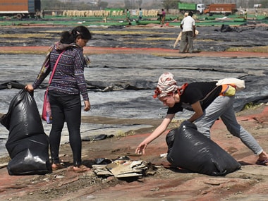 Volunteers cleaning the area after the World Culture Festival organised by the Art of Living in March 2016. Getty Images