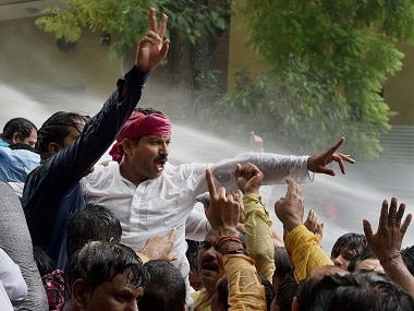 Delhi BJP chief Manoj Tiwari along with party workers holding a protest outside Chief Minister Arvind Kejriwals residence. PTI