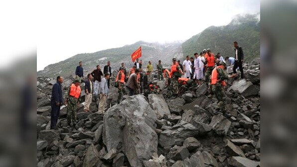 China landslide: 93 people missing in landslide, floods kill 34