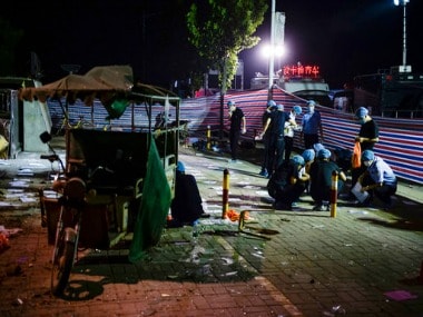 Photo released by China's Xinhua News Agency, investigators work early Friday, June 16, 2017, at the scene of an explosion outside a kindergarten in China. AP