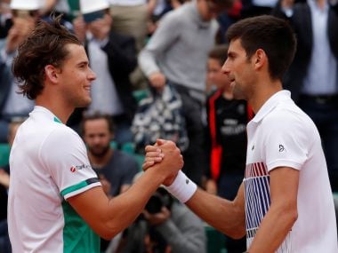 Dominic Thiem shakes hands with Novak Djokovic after winning their quarter-final. Reuters