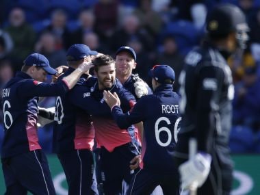 England's Mark Wood (centre) celebrates the wicket of New Zealand's Kane Williamson with teammates. Reuters