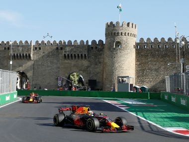 Red Bull Racing's Daniel Ricciardo (R) and Max Verstappen drive during the second practice session. Reuters