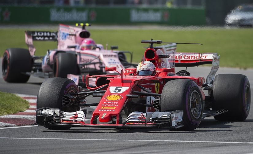 Ferrari driver Sebastian Vettel takes a turn at the Senna corner ahead of Force India driver Esteban Ocon at the Canadian Grand Prix. AP