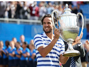 Spain's Feliciano Lopez with the trophy after winning Queen's Club tournament. AP
