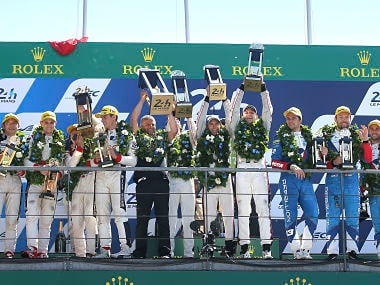 Members of the Porsche Team on podium of the 85th 24-hour Le Mans endurance race, . AP