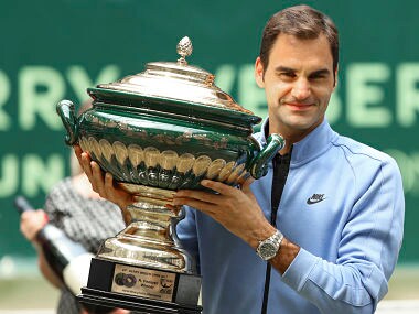 Switzerland's Roger Federer celebrates his victory after the final match against Germany's Alexander Zverev at the Gerry Weber Open tennis tournament in Halle, Germany, Sunday, June 25, 2017. Roger Federer defeated Germany's Alexander Zverev in two sets to win the Gerry Weber Open for the ninth time on Sunday. (Friso Gentsch/dpa via AP)