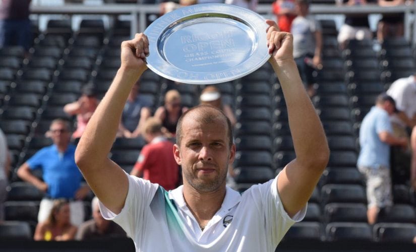 Gilles Muller lifts his trophy after defeating Ivo Karlovic in the final at 's-Hertogenbosch. Image courtesy: Twitter/@RicohOpen