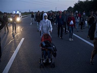 Thousands in Madrid march for refugees; chant slogans such as No human being is illegal