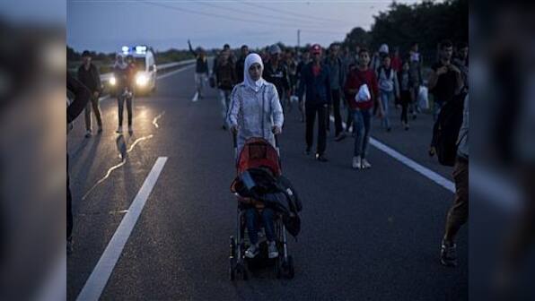 Thousands in Madrid march for refugees; chant slogans such as 'No human being is illegal'
