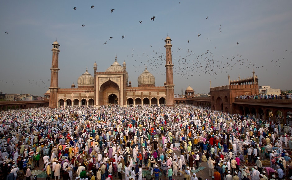 The festival marks the culmination of fasting. The holy month of Ramadan, the ninth month of the Islamic lunar calendar, is observed as a fasting period by Muslims who abstain from food and water from sunrise to sunset. In this photo, Muslims hug and greet each other after Eid-ul-Fitr prayers at the Jama Masjid Mosque in New Delhi, India on Monday. AP The festival marks the culmination of fasting. The holy month of Ramadan, the ninth month of the Islamic lunar calendar, is observed as a fasting period by Muslims who abstain from food and water from sunrise to sunset. In this photo, Muslims hug and greet each other after Eid-ul-Fitr prayers at the Jama Masjid Mosque in New Delhi, India on Monday. AP