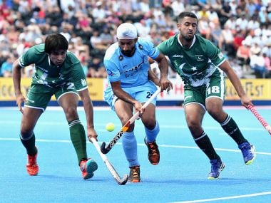 Talwinder Singh of India tangles with Muhammad Aleem Bilal and Muhammad Yaqoob of Pakistan during their match. Getty