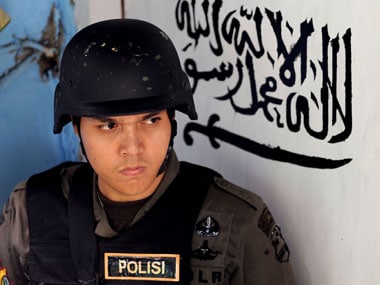 Indonesian policeman killed in attack by Islamist militants; one suspect shot dead