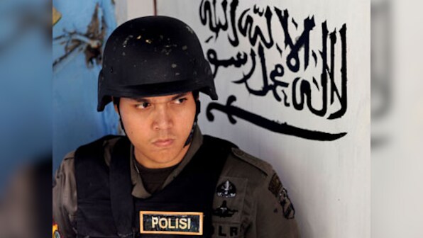 Indonesian policeman killed in attack by Islamist militants; one suspect shot dead