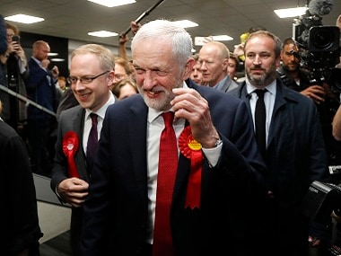Jeremy Corbyn smiles after arriving for the declaration at his constituency in London. AP