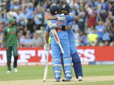 Virat Kohli, and Rohit Sharma celebrate after India's victory in the semifinal match against Bangladesh at Edgbaston. AP