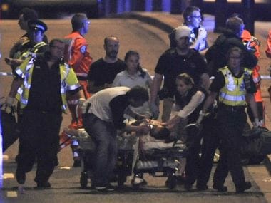 Police and members of the emergency services attend to victims of a terror attack on London Bridge on Saturday. AFP