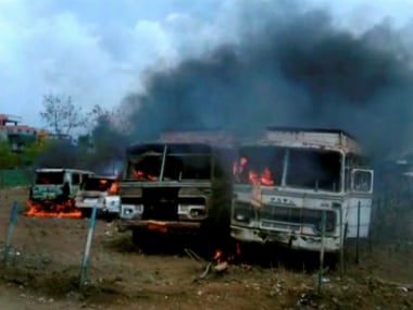 Burns torched by agitating farmers on Bhopal-Indore highway in Dewas district on Wednesday. PTI