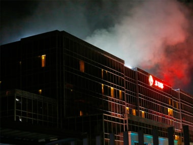 Smoke rises from the Resorts World Manila complex early Friday where a gunman shot 37 people dead. AP