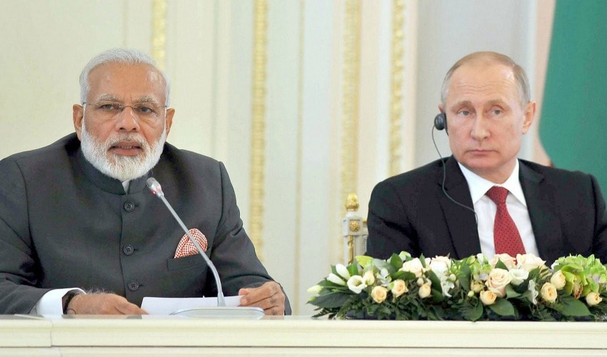 Narendra Modi and Vladimir Putin at India-Russia CEO’s meeting at Konstantin Palace in St Petersburg on Thursday. PTI