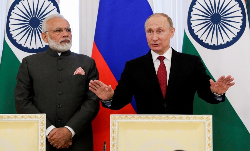 Narendra Modi and Vladimir Putin at St Petersburg International Forum on Thursday. PTI