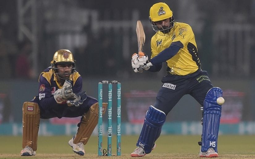 Mohammad Hafeez (R) of Peshawar Zalmi plays a shot as Quetta Gladiators captain and wicketkeeper Sarfraz Ahmed looks on during the final of the Pakistan Super League. Getty