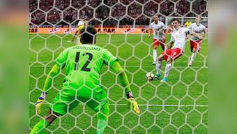 World Cup qualifiers: Robert Lewandowski's hat-trick against Romania keeps them atop Group E