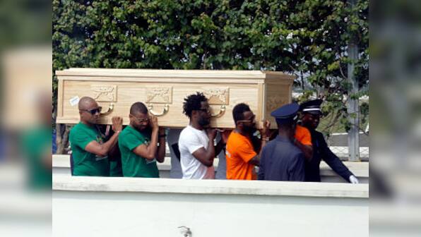 Cheick Tiote's body arrives in Ivory Coast as thousands turn up at Abidjan Airport to mourn footballer