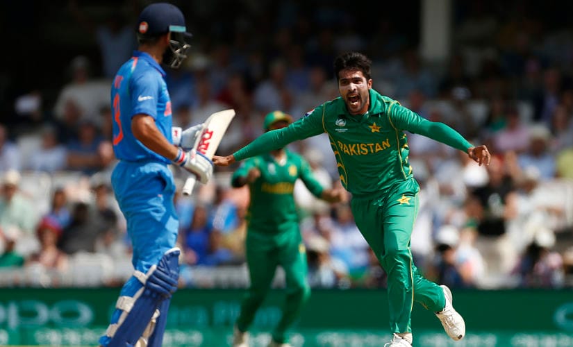 Pakistan's Mohammad Amir celebrates taking the wicket of India's Virat Kohli. Reuters