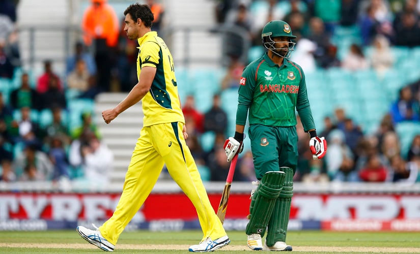 Bangladesh's Tamim Iqbal walks off after being dismissed by Australia's Mitchell Starc (L). Reuters