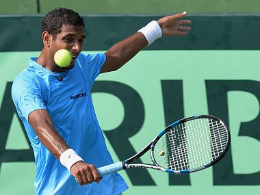 Indian player Ramkumar Ramanathan plays a shot during his singles match against Uzbekistan's Sanjar Fayziev at the Davis Cup Asia Oceania group one tie match held between India and Uzbekistan at the Karnataka State Lawn Tennis Association (KSLTA) Stadium, in Bangalore on April 9, 2017. / AFP PHOTO / Manjunath KIRAN