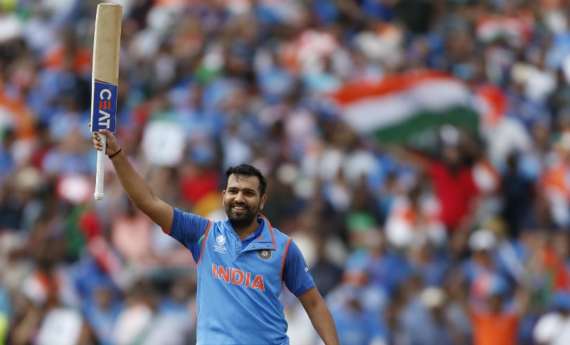India's Rohit Sharma raises his bat on scoring a century in the semi-final against Bangladesh at Edgbaston. Reuters