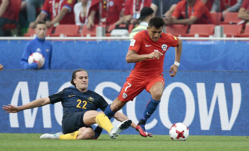 Chile's Alexis Sanchez, right, escapes Australia's Jackson Irvine during the Confederations Cup, Group B soccer match between Chile and Australia, at the Spartak Stadium in Moscow, Sunday, June 25, 2017. (AP Photo/Ivan Sekretarev)