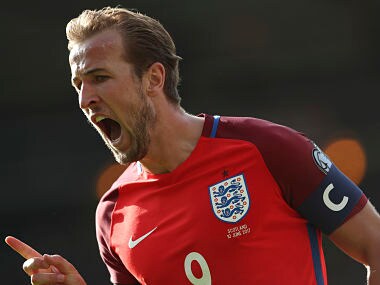 England's Harry Kane celebrates after scoring his side's second goal against Scotland during the World Cup Group F qualifying match. AP