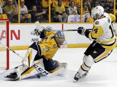 Nashville Predators goalie Pekka Rinne, stops a shot by Pittsburgh Penguins left wing Chris Kunitz. AP
