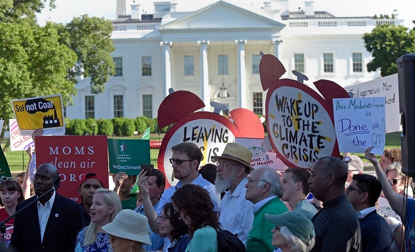 Protesters gather outside the White House to protest President Donald Trump's decision to withdraw the Unites States from the Paris climate change accord. AP