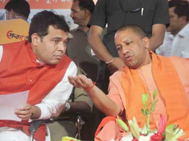 Uttar Pradesh Chief Minister Yogi Adiyanath along with state power minister, Shrikant Sharma, at an event in Allahabad. PTI