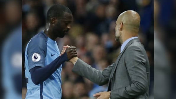 Premier League: Manchester City manager Pep Guardiola challenges Yaya Toure to win back place in squad