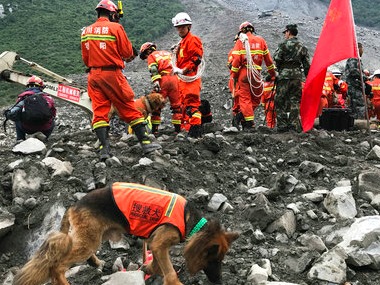 China landslide: Rescue crews recover nine bodies as search operations continue China landslide: Rescue crews recover nine bodies as search operations continue