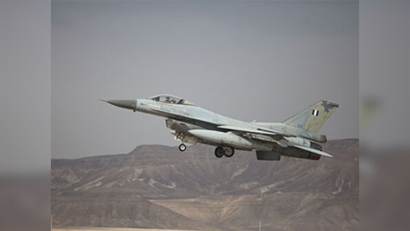 F-16 pilot ejects to safety after fighter jet crashes into warehouse at March Air Reserve Base in Southern California; 5 people injured