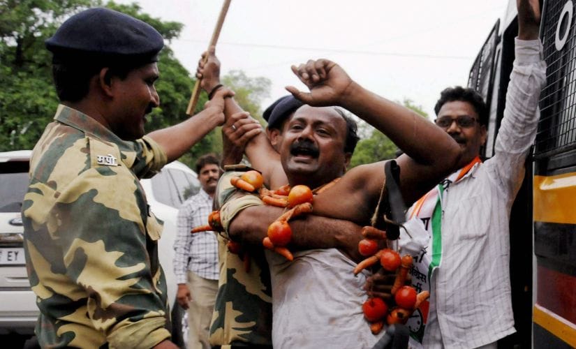 Police detain NCP farmers during a protest as part of their Maharashtra bandh over various demands, in Nagpur on Monday. PTI