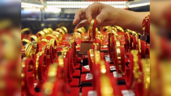 Gold falls by Rs 200 to Rs 32,620 per 10 gram on sluggish local demand, weak global cues; extends losses for 4th day