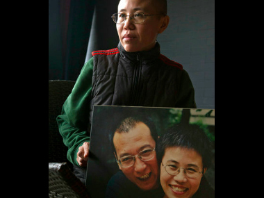 China faces international pressure to free Nobel laureate Liu Xiaobo's widow China faces international pressure to free Nobel laureate Liu Xiaobo's widow