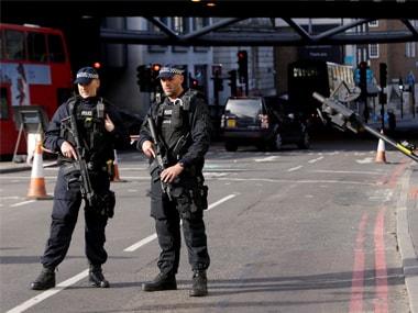 Two armed police guard an area near Borough Market in the London Bridge area of London on Monday. AP